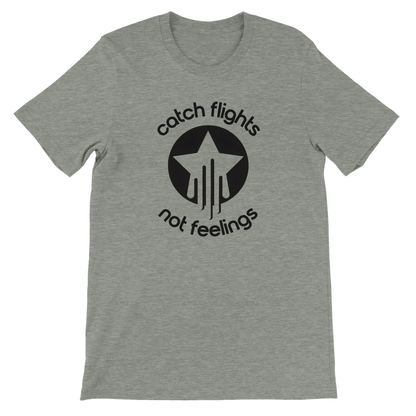 Athletic heather unisex t-shirt with a bold black graphic that reads “catch flights not feelings” curved around a star and streak icon, printed on the chest.