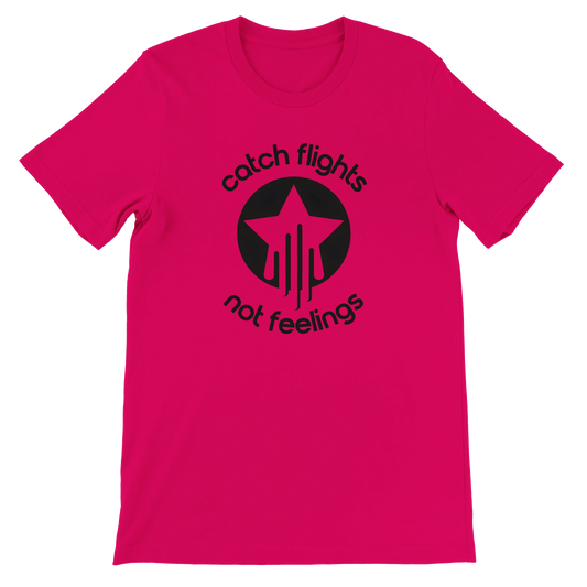 Fuchsia unisex t-shirt with a bold black graphic that reads “catch flights not feelings” curved around a star and streak icon, printed on the chest.