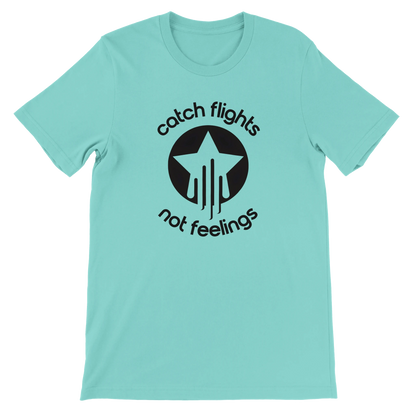 Mint unisex t-shirt with a bold black graphic that reads “catch flights not feelings” curved around a star and streak icon, printed on the chest.