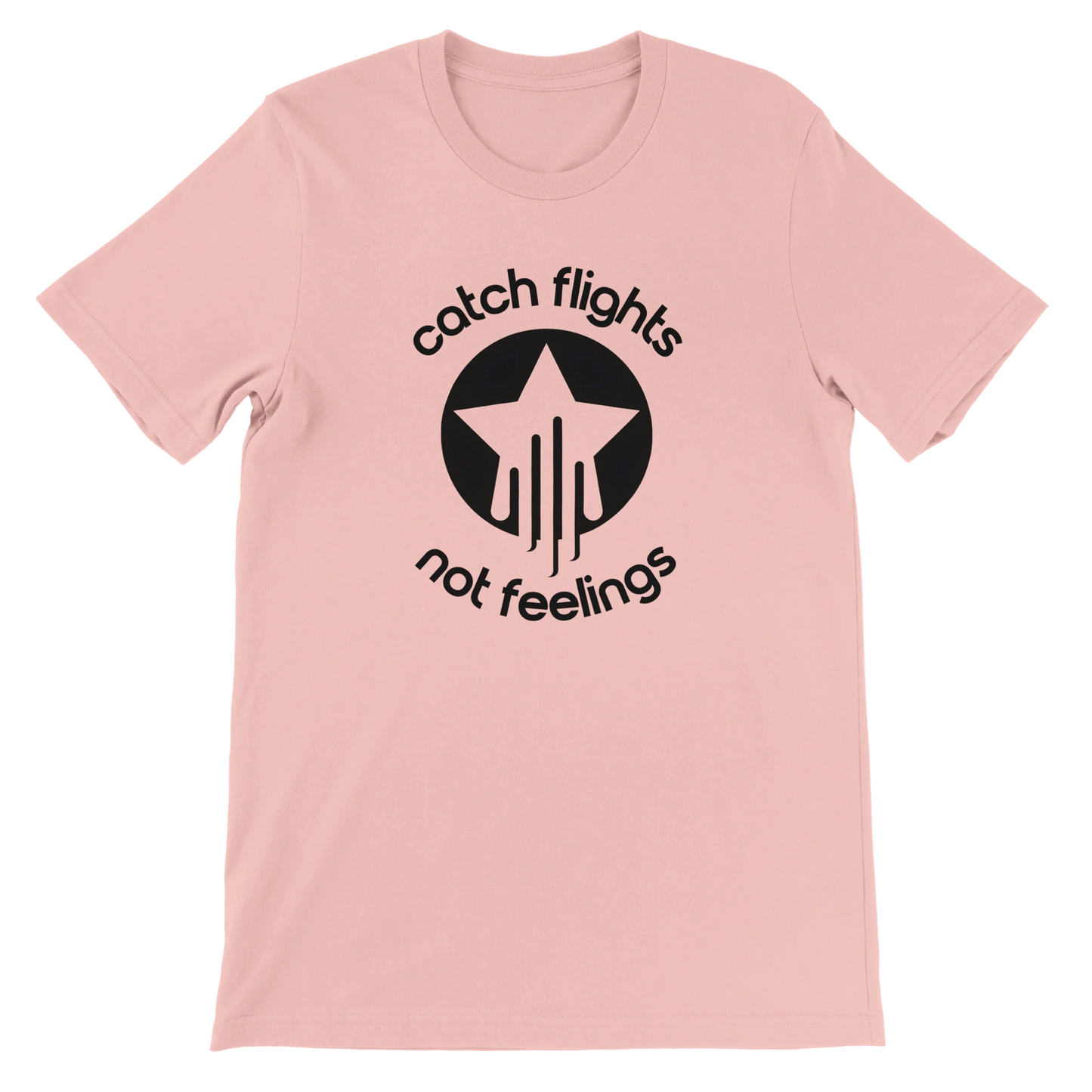 Soft pink unisex t-shirt with a bold black graphic that reads “catch flights not feelings” curved around a star and streak icon, printed on the chest.