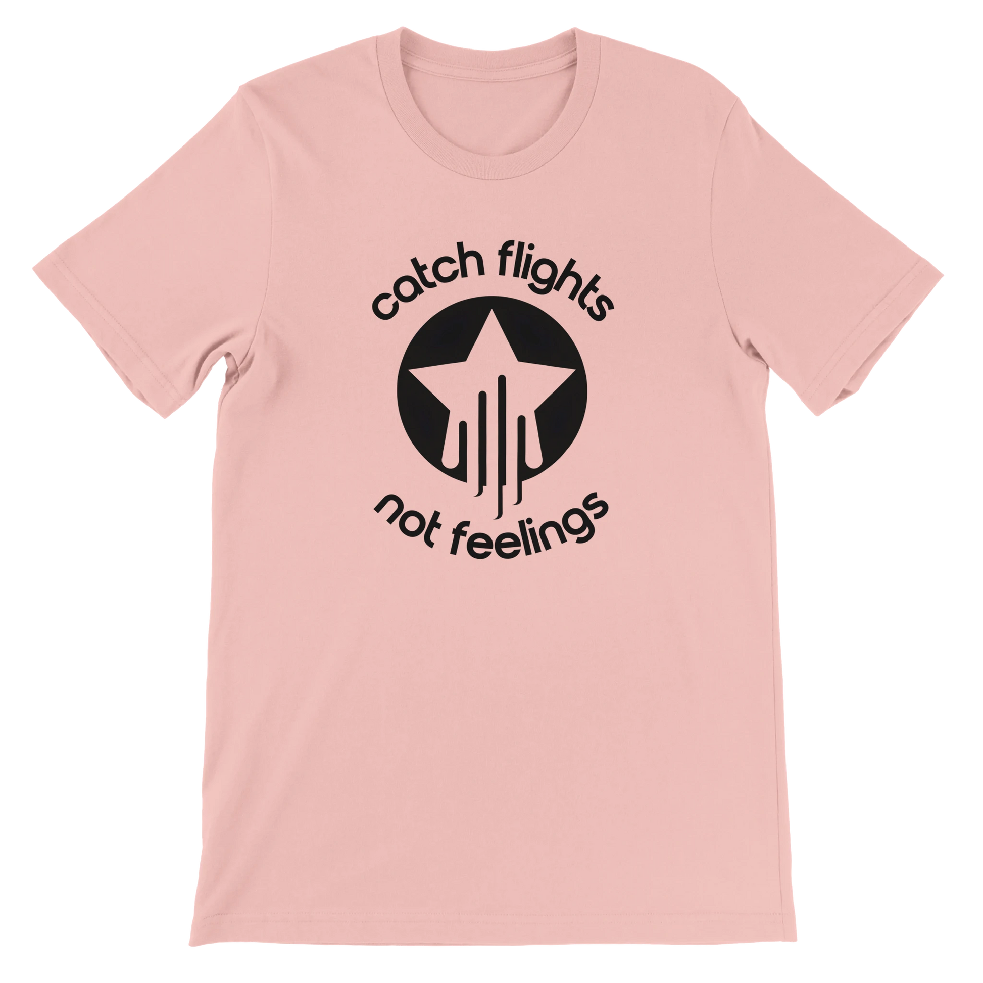 Soft pink unisex t-shirt with a bold black graphic that reads “catch flights not feelings” curved around a star and streak icon, printed on the chest.