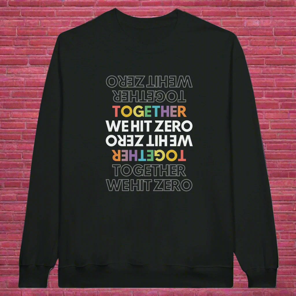 Flat lay of black crewneck sweatshirt featuring mirrored rainbow “TOGETHER WE HIT ZERO” graphic from Hit Zero Co's Beyond the Mat Collection.