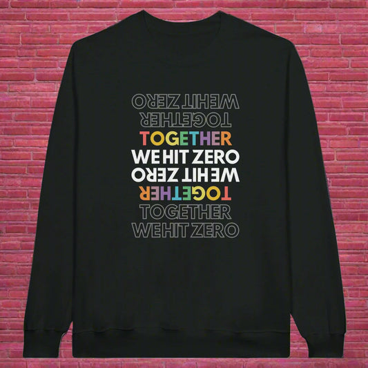 Flat lay of black crewneck sweatshirt featuring mirrored rainbow “TOGETHER WE HIT ZERO” graphic from Hit Zero Co's Beyond the Mat Collection.