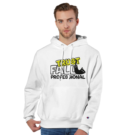 Model wearing a white Champion pullover hoodie with the “Trust Fall Professional” graphic on the front, featuring bold yellow and black lettering and a falling cat illustration.
